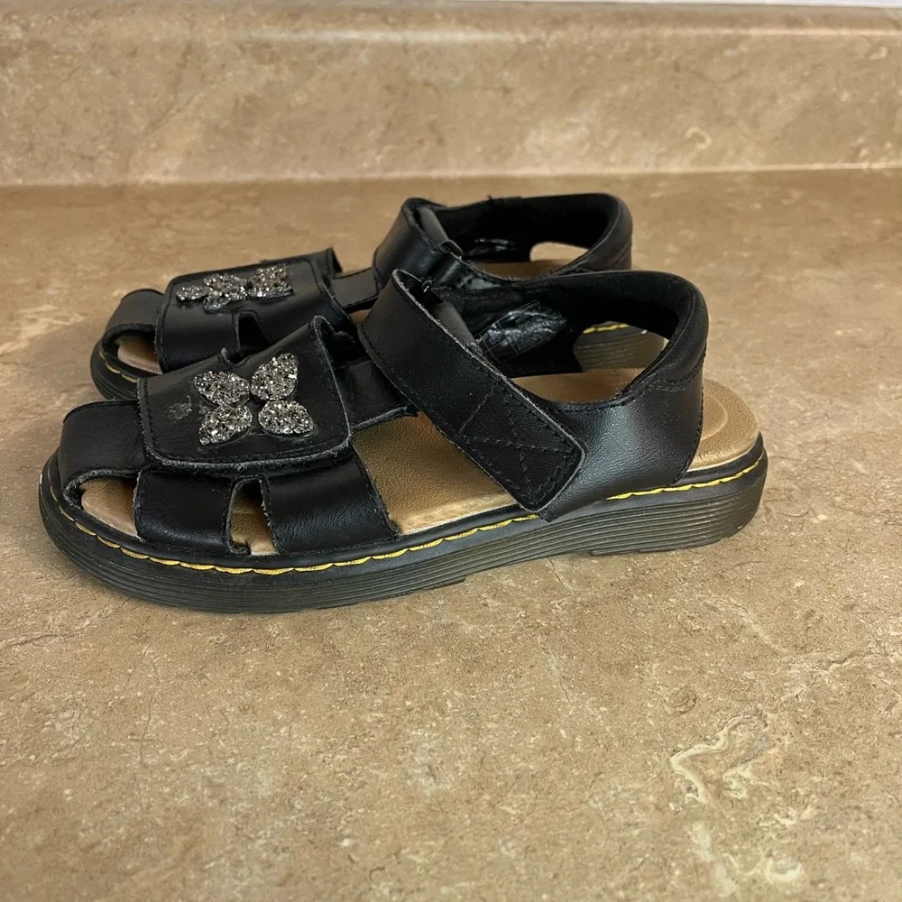 Kids Black Dr.Marten’s Glitter Flower Strap Sandals
